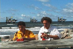 Stiil from The Battle At Our Shores: Jeff and Neal Livingston eating lobster